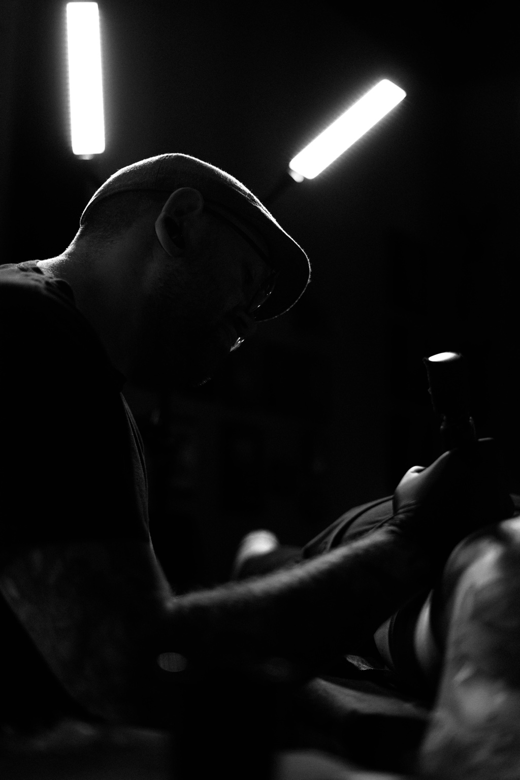 George Weibe tattooing a client in his private studio